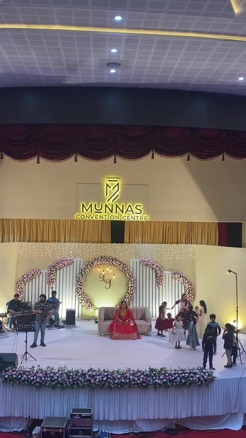 The grand stage at Dwarka Palace, dressed for a Tamil wedding reception, Madurai